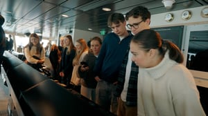 Students looking at Havila Pollux' bridge system from Norwegian Electric Systems